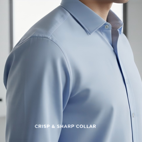 Light blue dress shirt with a crisp and sharp collar, worn by a person.